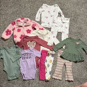 Baby girl onesies, pants, and sweater bundle